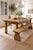 A charming antique English pine bench, rich in character and showcasing a beautifully timeworn patina. Crafted from solid...
