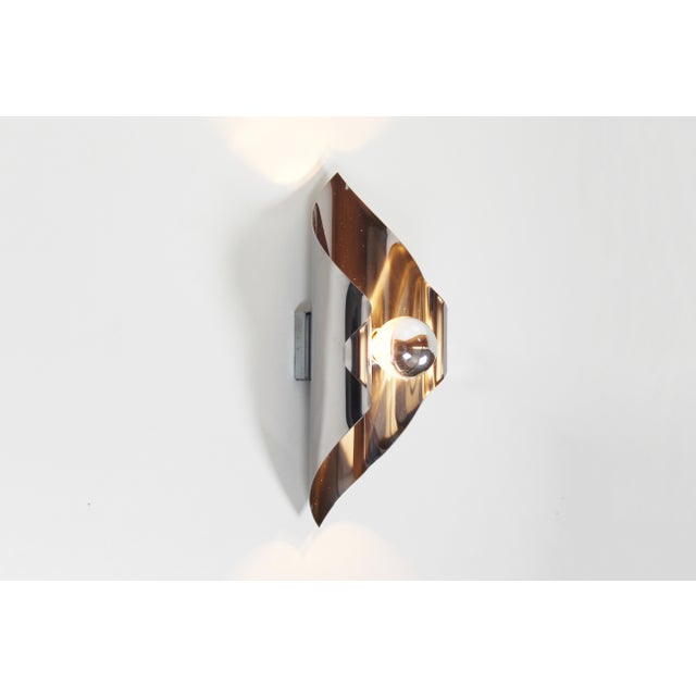 Playful set of metal 'space age' wall lamps, produced in the 1970s in France. Both in perfect condition with minimal signs...
