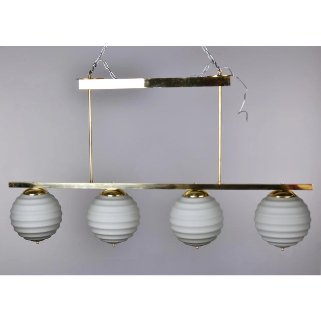 New Italian Fixture With 4 Pale Taupe Globes on Horizontal Brass Bar For Sale - Image 4 of 12