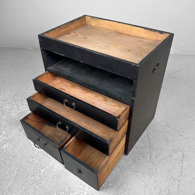 This beautiful antique Japanese cabinet combines functionality with timeless elegance. It features four small drawers and...