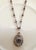 Vintage Sterling Silver Necklace by Designer Liz Palacios Sf, Featuring a Mother of Pearl Pendant With a Central Crystal, and Dangling Charm Accent For Sale - Image 4 of 5
