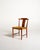 Set of four teak chairs with contoured backrests, ochre-colored fabric-upholstered seats, and tapered legs. Designed by...