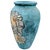 A large textured urn shaped vessel/vase. The terracotta pottery has a basecoat of black paint with a textured...