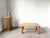 1970s Scandinavian coffee table in solid pine, reminiscent of Rainer Daumiller's designs. It embodies the hallmarks of...