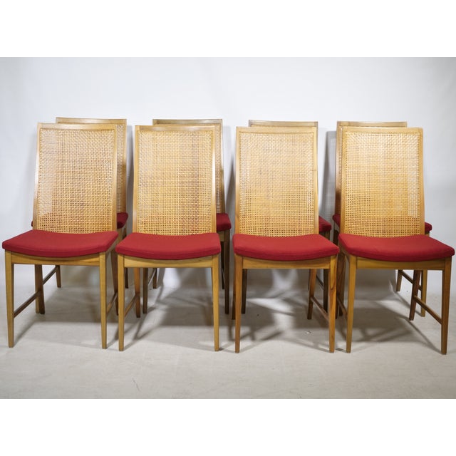 Set of 8 elegant walnut dining chairs with woven backs by Dillingham from the 1960s. Solid walnut frame with Viennese cane...