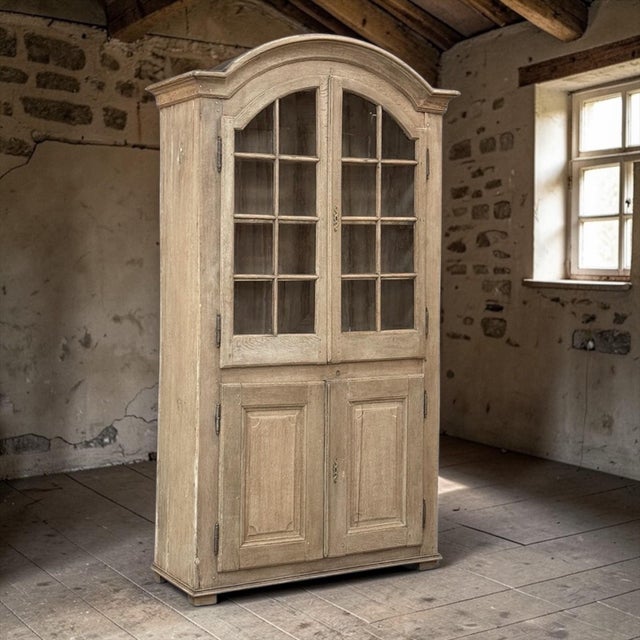 18th Century Rustic French Neoclassical Bookcase was meticulously hand-crafted from select, old growth French white oak to...