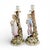 A decorative matched pair of late 19th-century German porcelain candlesticks attributed to Sitzendorf. Each candlestick is...