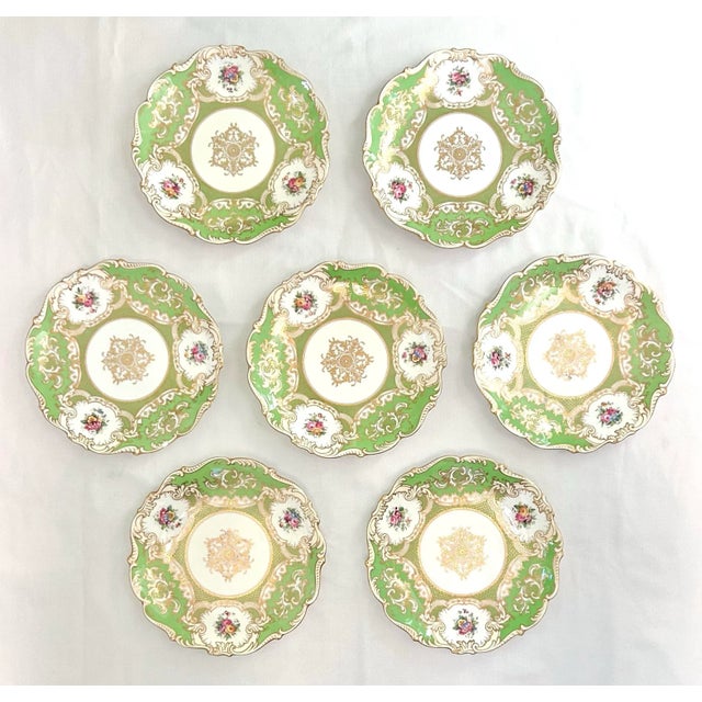 A stunning set of antique porcelain English Coalport dinner plates in Apple Green. They are a stunning bright green with...