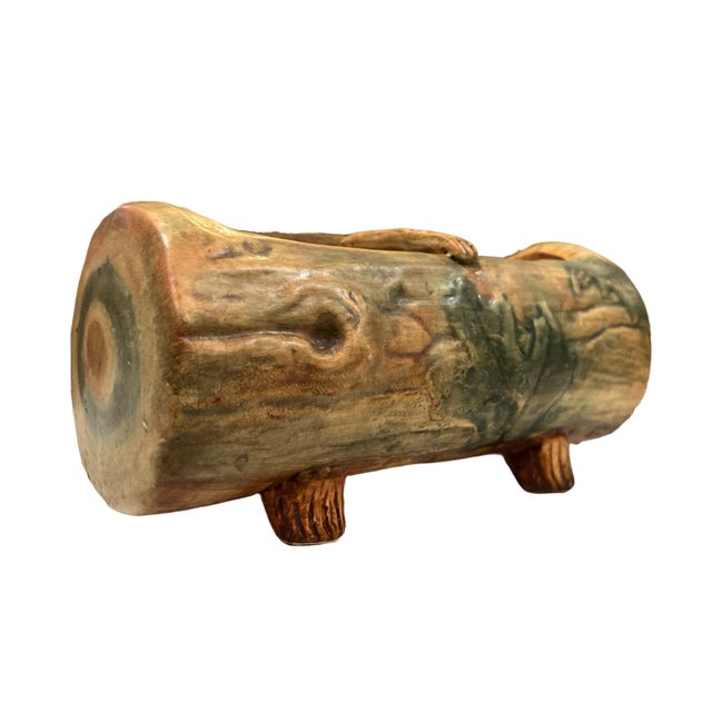 Excellent Weller Pottery Piece in the form of a cut log. Features hand-painted details including green leaves and tree...
