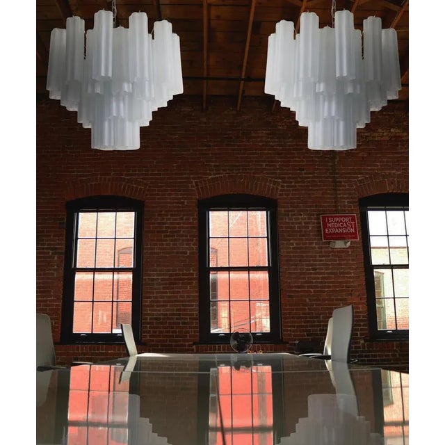 Italian vintage chandeliers in Murano glass and nickel-plated metal structure. The armor polished nickel supports 36 large...