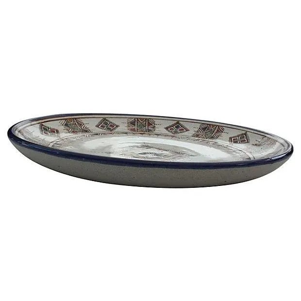 Handcrafted Moroccan ceramic plate with hand-painted diamond pattern. Has hanger on back for wall display.