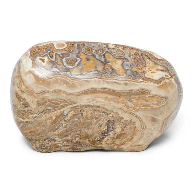 Following the sculpted form, marbled coloring, and natural veining of this one-of-a-kind stone can be deeply meditative....