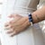 The Eye of Love Chunky Lapis Lazuli Beaded Bracelet is a stunning piece of handmade jewelry that is sure to capture...