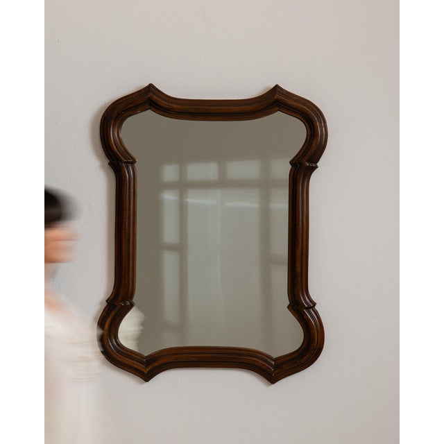 Carved wood scalloped mirror in Rich Walnut Brown. Its rich walnut brown finish sets off ornate scalloped silhouette,...