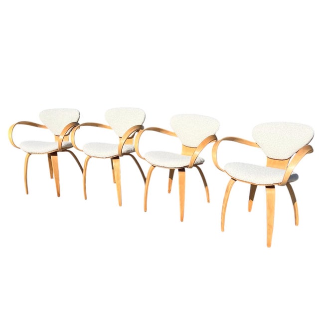 Set of 4 bent plywood "Pretzel" chairs by Norman Cherner for Plycraft, circa 1964. Refinished wood, newly upholstered in...