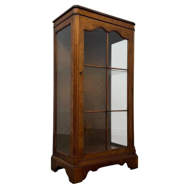 A handsome and finely crafted 20th-century display cabinet, beautifully finished in richly figured burr walnut and...