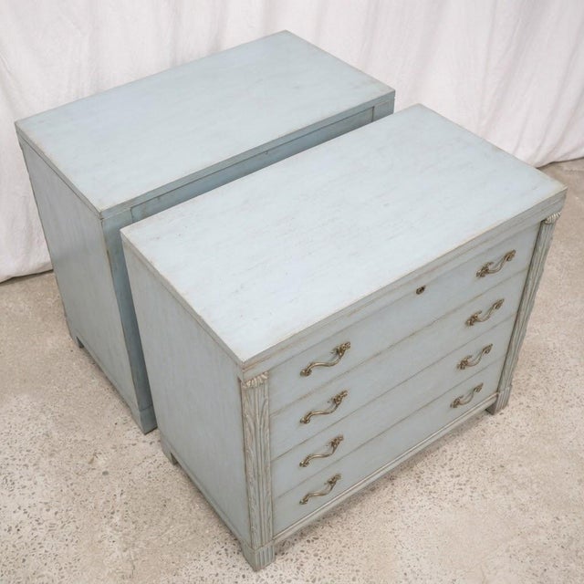 This is a pair of 1950s John Stuart French blue painted neo-classical style chests. The base is mahogany. They are marked...