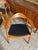 Iconic solid teak chairs with black leather seats in the style of Hans Wegner, circa 1960s(?). There are three available....