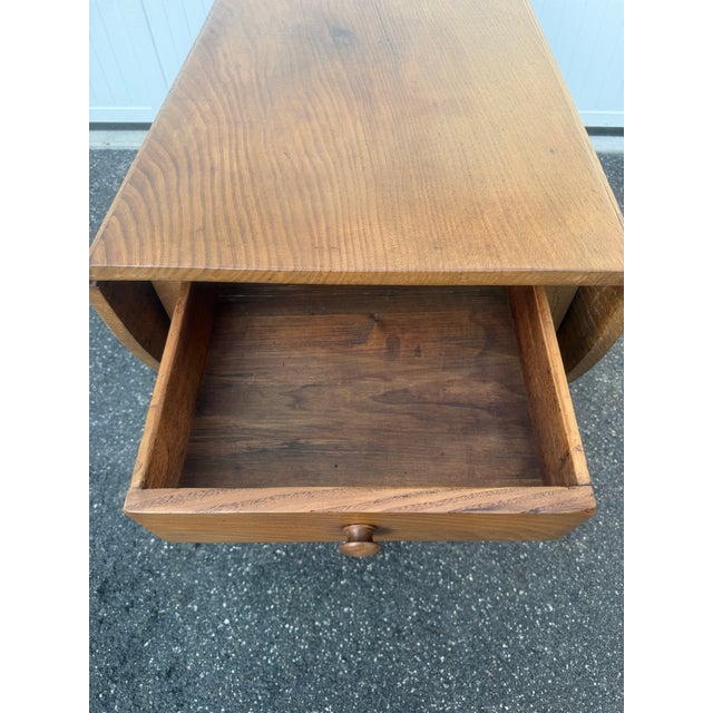 Bring timeless American craftsmanship into your home with this beautiful antique gate-leg drop-leaf table. Constructed...
