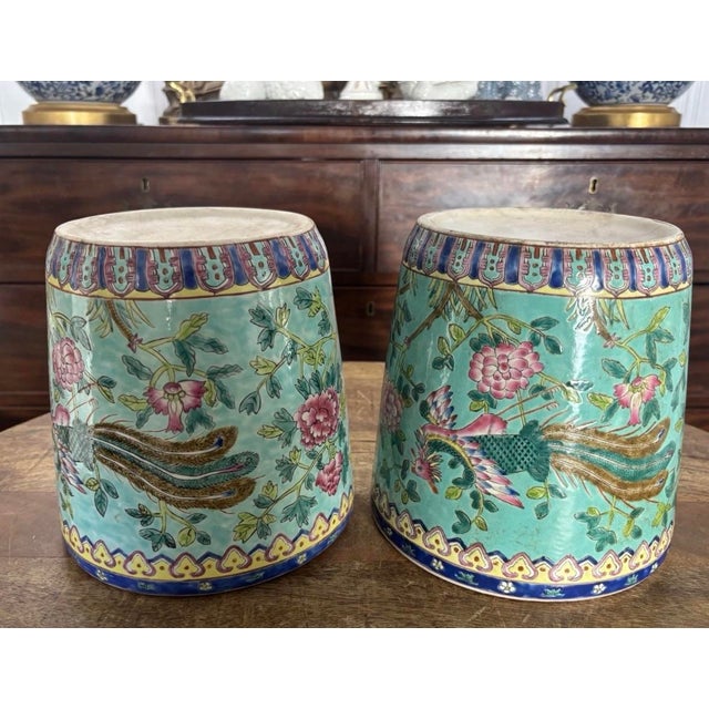 Absolutely stunning pair of turquoise ground famille rose cachepots with loveliest enameled decoration. Brilliant...