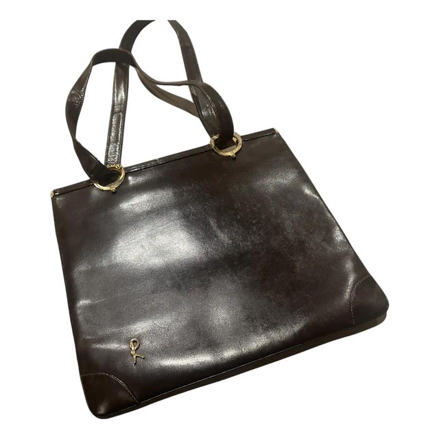 1980s Iconic Brown Leather and Brass Shoulder Bag by Roberta Di Camerino For Sale