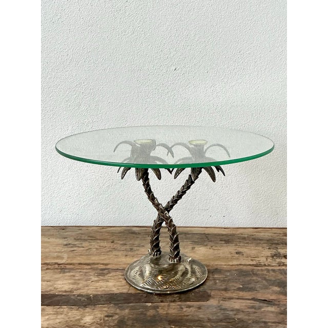 Infuse your next gathering with the tropical glamour of the Hollywood Regency era with this striking crossed palm tree...