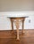 An exceptional vintage cast metal accent table featuring an ornate sculptural base with dramatic Gothic Revival and...