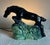 Vintage art deco ceramic television / table lamp made by Haeger. Features a black horse jumping over greenery.