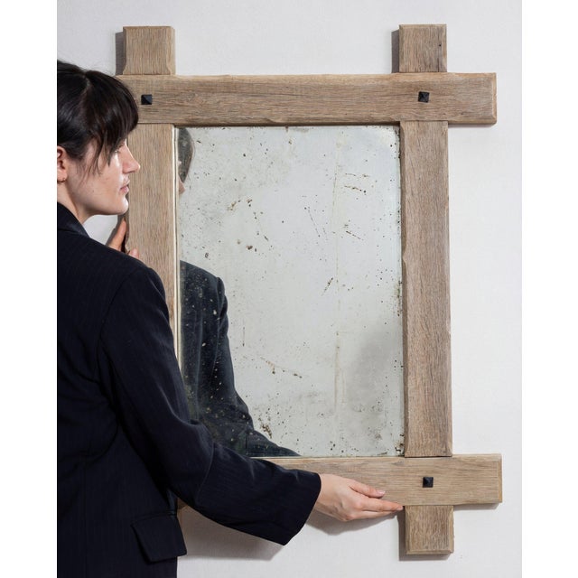 This piece presents as a mirror, distinguished by natural bleached oak, black square accent. The piece dates to 1970s,...