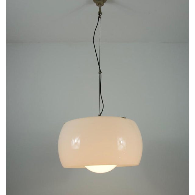 This impressive and rare pendant lamp, model ‘omega,’ was designed by the renowned italian architect and designer vico...