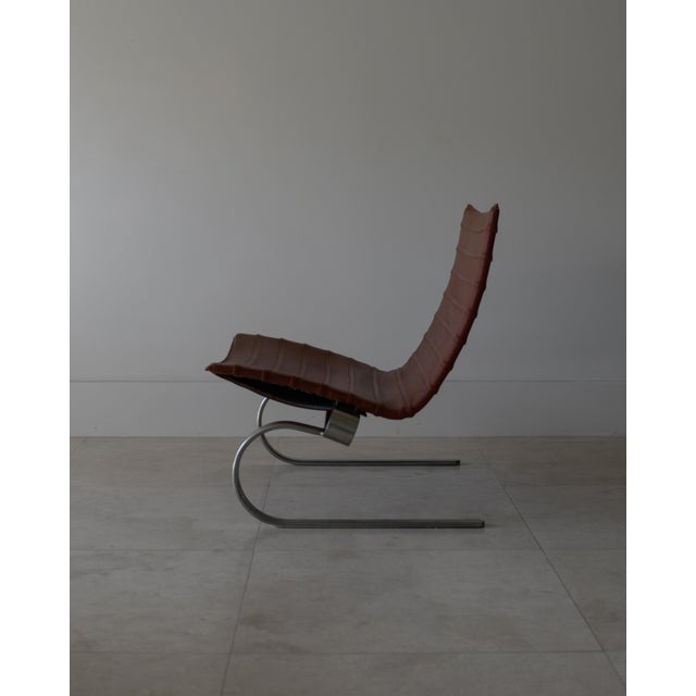 A beautiful 1991 PK20 lounge chair designed by Poul Kjærholm. This is one of those pieces that really stands out without...