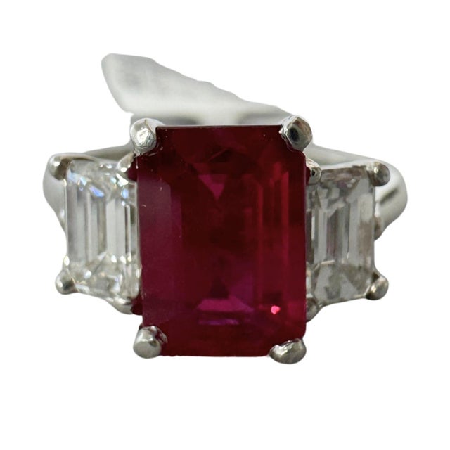 GIA Certified 1.65 Carat D/VS1 Diamond with 2.85 Carats of Burmese Rubies, Platinum Ring Centering an elegant emerald-cut...