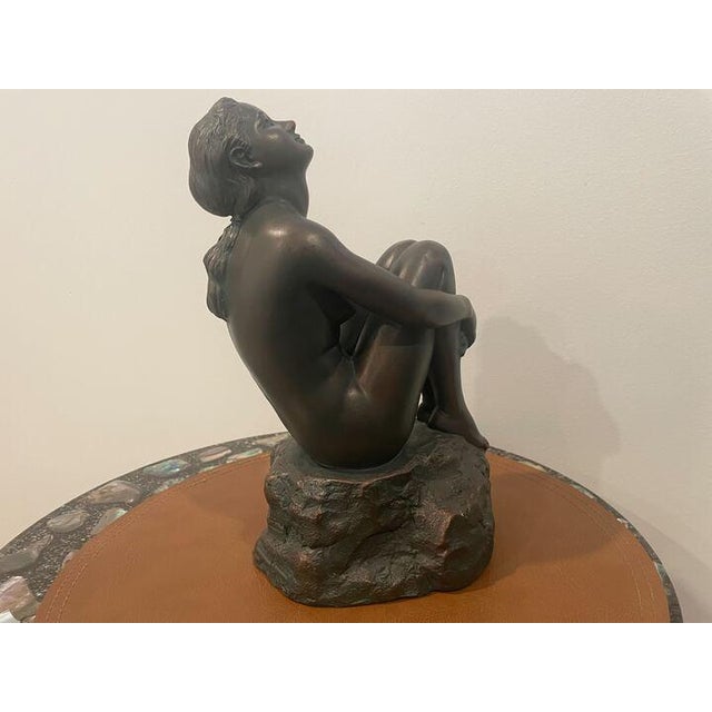 Vintage Austin Productions sculpture depicting an elegant seated woman in the Art Deco style. Crafted from Durastone...