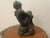 Vintage Austin Productions sculpture depicting an elegant seated woman in the Art Deco style. Crafted from Durastone...
