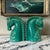 A striking pair of oversized turquoise glazed ceramic horse bookends showcasing bold Art Deco-inspired design and...