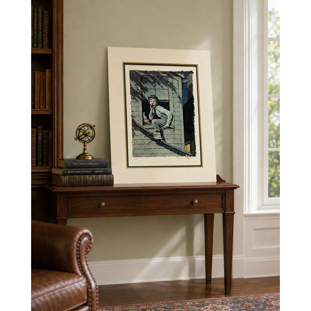 A hand-numbered 7/200 color collotype from Norman Rockwell’s celebrated Tom Sawyer Suite, professionally matted and ready...
