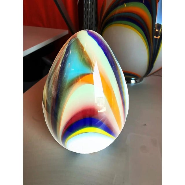 Small white egg lamp in murano glass with multicolored reeds fused together. multicolored glass rods create spectacular...