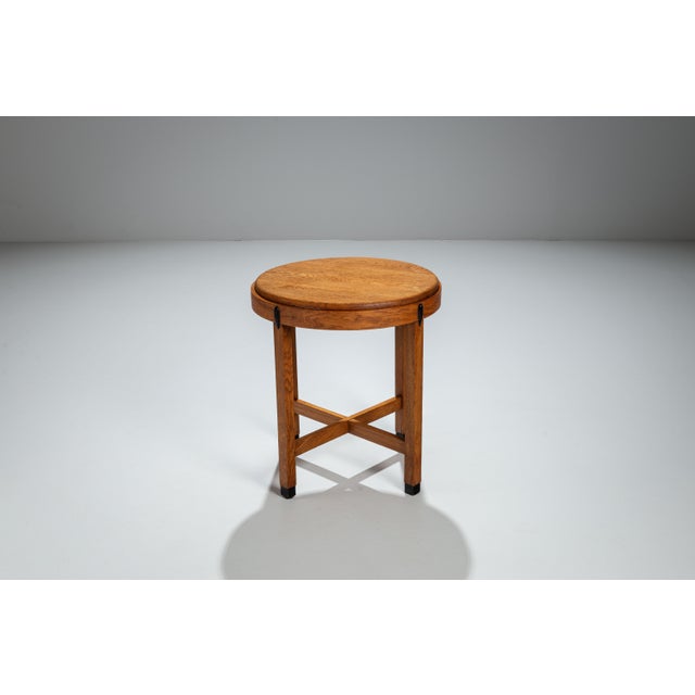 This elegant Art Deco sidetable is a fine example of the expressive craftsmanship associated with the Amsterdamse School...