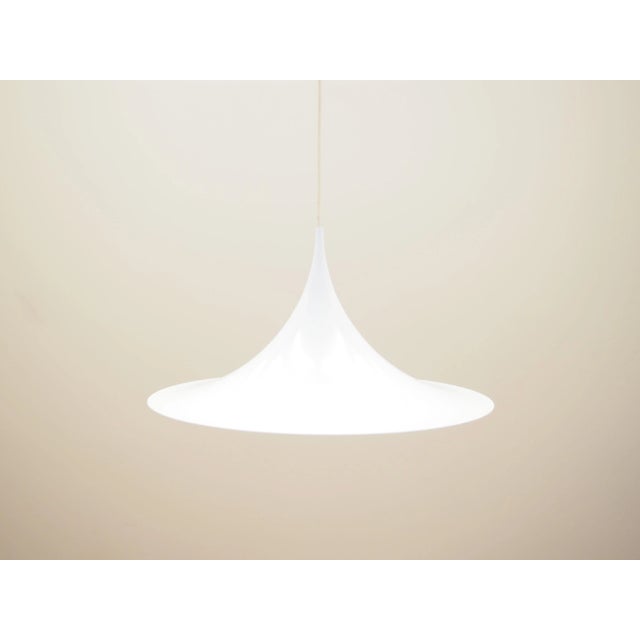 The lamp was made in the 1970s, Danish production. Made of metal in white. The unique construction is not only a design...