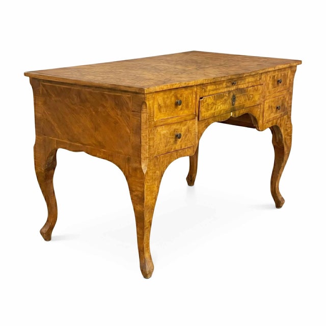 Baroque walnut veneered centerpiece writing desk. Elegant and sinuous centerpiece writing desk, finished on all sides to...