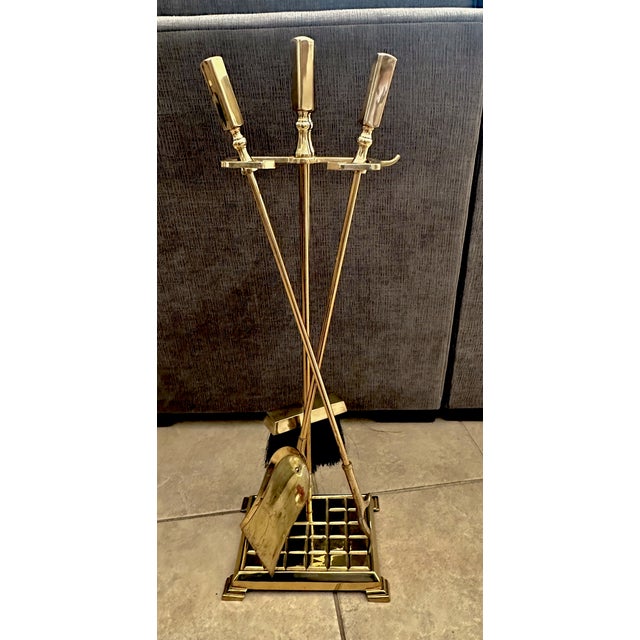 A handsome set of brass fireplace tools set, with square solid brass modernist style handles.