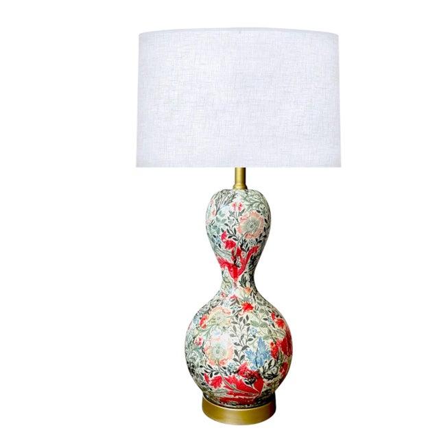 Make a bold designer statement with this striking double gourd table lamp featuring an intricate, all-over botanical...