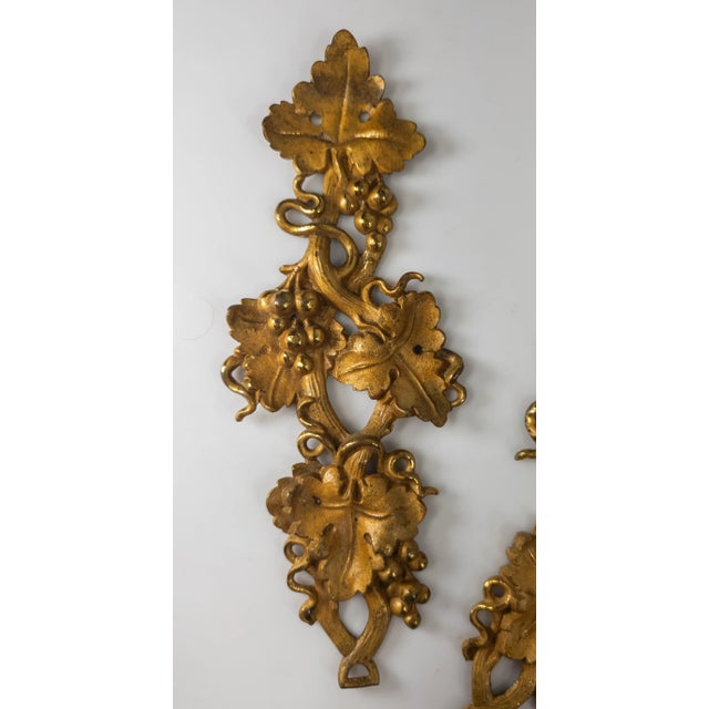 We are selling this group of 3 pretty Architectural accents. These gilt bronze pieces with grape leaf and bunch motif are...