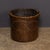 An antique early 20th Century Edwardian log bucket, with a wooden frame and vellum exterior, lined in metal. The bucket is...