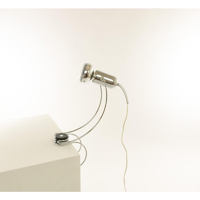 Adjustable chrome table lamp designed by Francesco Fois and manufactured by Reggiani during the 1960s. The lamp, with its...