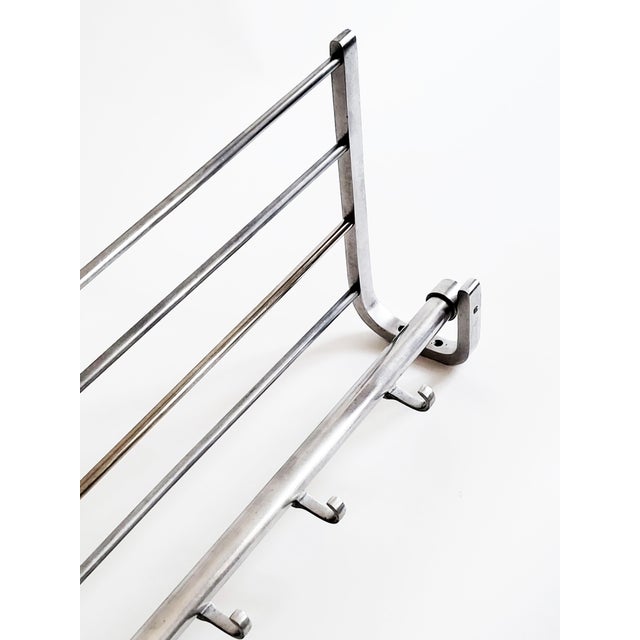 Beautifully minimalist Austrian Art Deco/Bauhaus style aluminum wall rack from the 1930s with original hooks – an ideal...