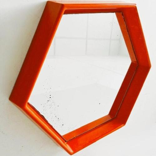 What a gem, this mid-century space age pop art hexagon mirror in orange, made of plastic from the 1970s. The retro orange...