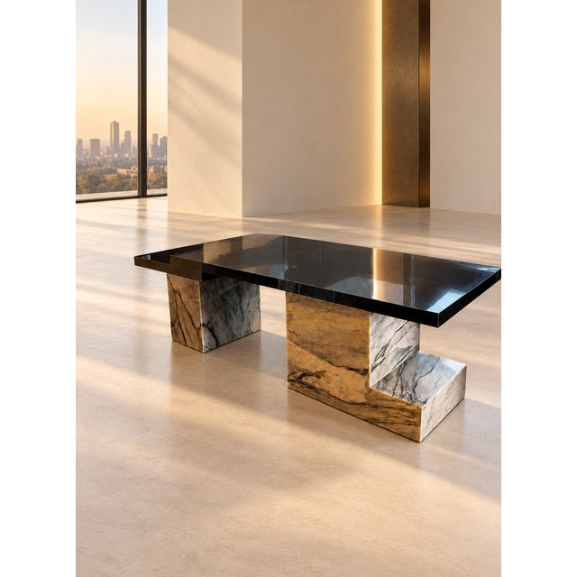 Handcrafted sculptural coffee table by Wasel Torres, featuring a polished black porcelain tabletop and natural Rhino...