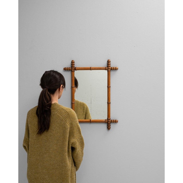 This mirror makes its impression through faux bamboo wood frame, natural brown, smaller. Dating to 19th Century and...