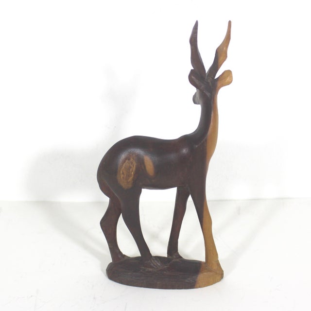 Classic mid century modern hand carved wood gazelle sculpture. No damage detected. Beautiful exotic wood. I love these for...